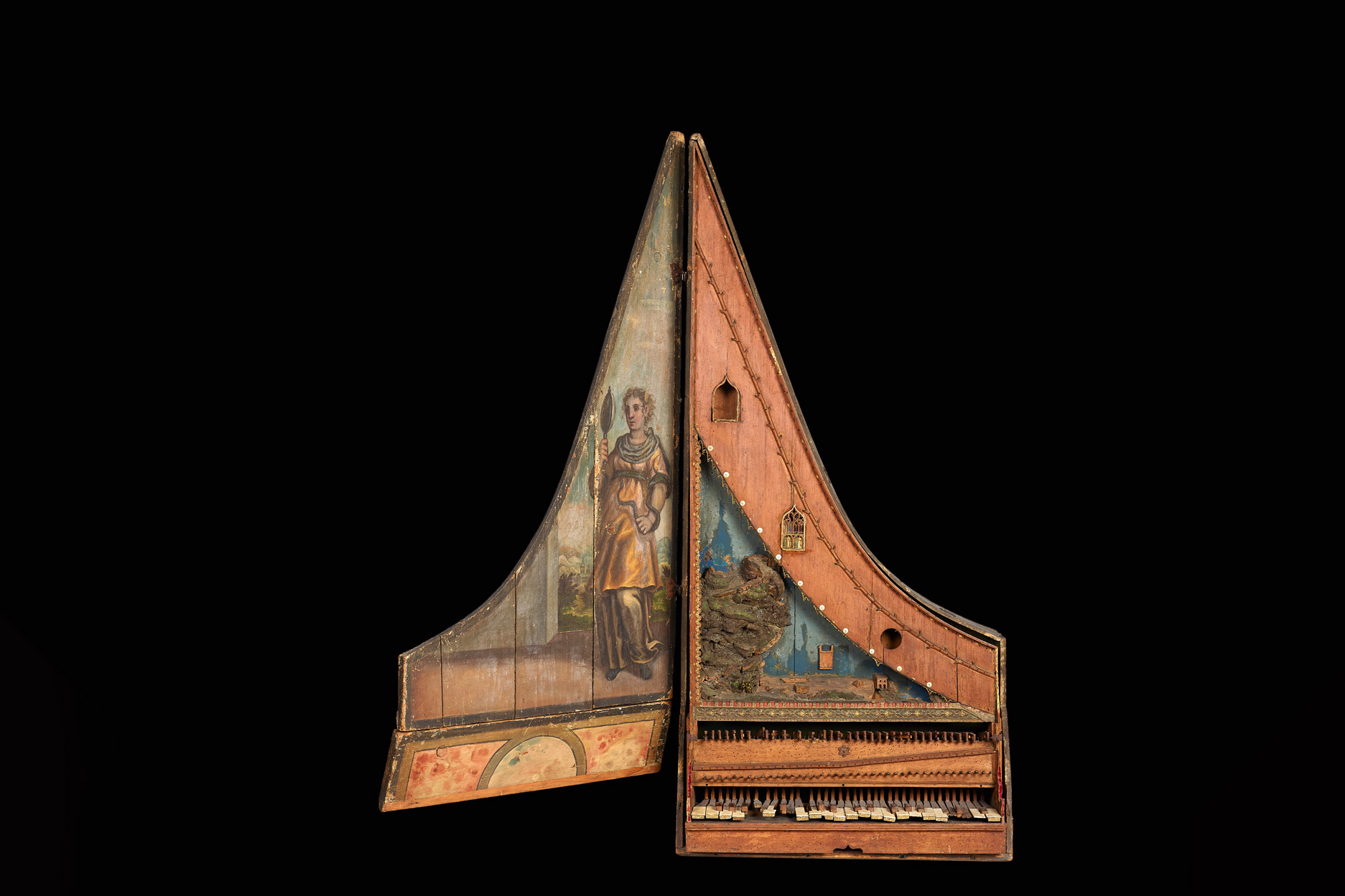 A historical wooden clavicytherium with a black background behind them, from Anon, South German [c1480]